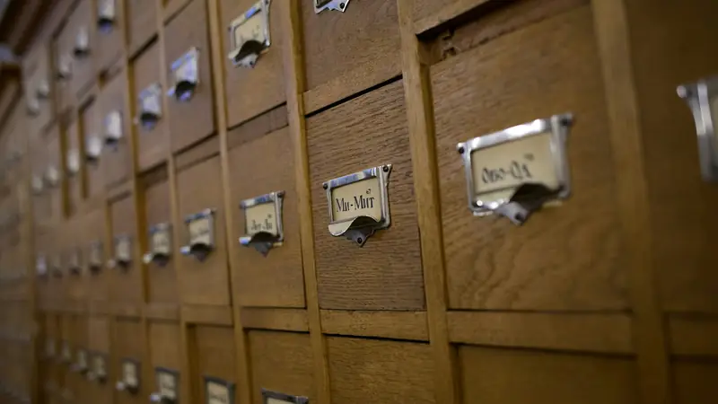 Library card catalog drawers with metal label holders