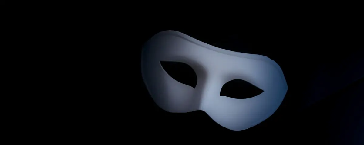 A white mask on a black background